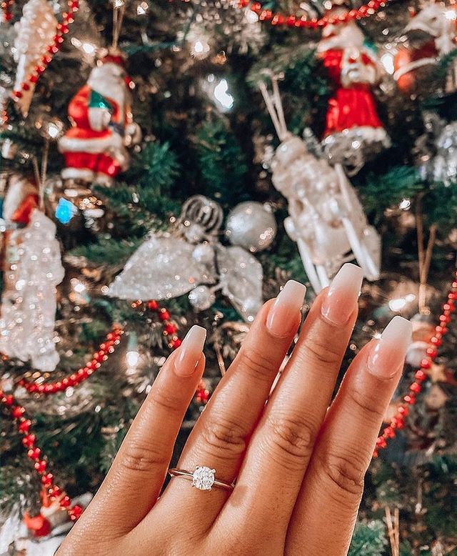 Engagement ring selfie in front of Christmas tree