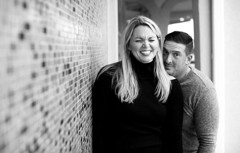 A picture of Heather and Rene trying really hard to take their engagement photo shoot seriously.