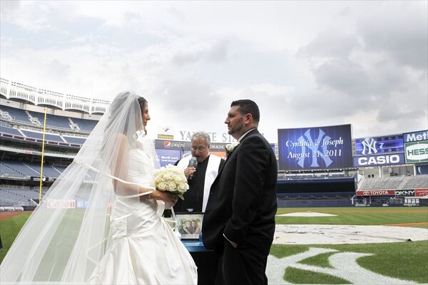 Donning wedding attire, New York Yankees fans celebrate marriage at Yankee  Stadium