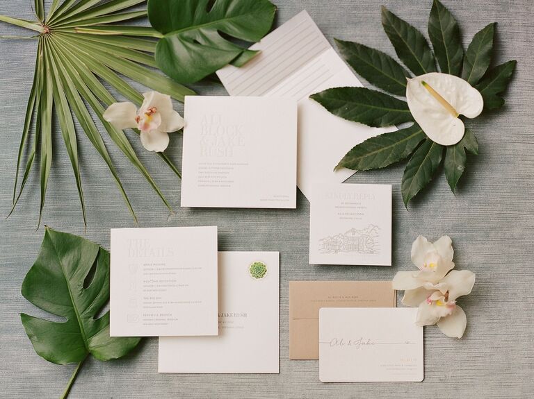 An elegant neutral-toned wedding invitation suite.