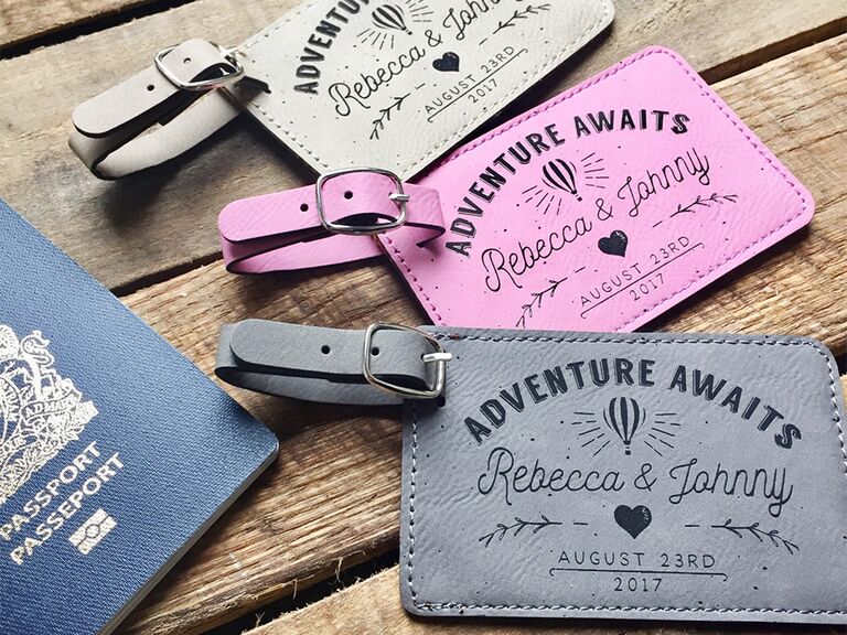 Pink, white and gray leather tags with 'Adventure awaits,' hot air balloon and names