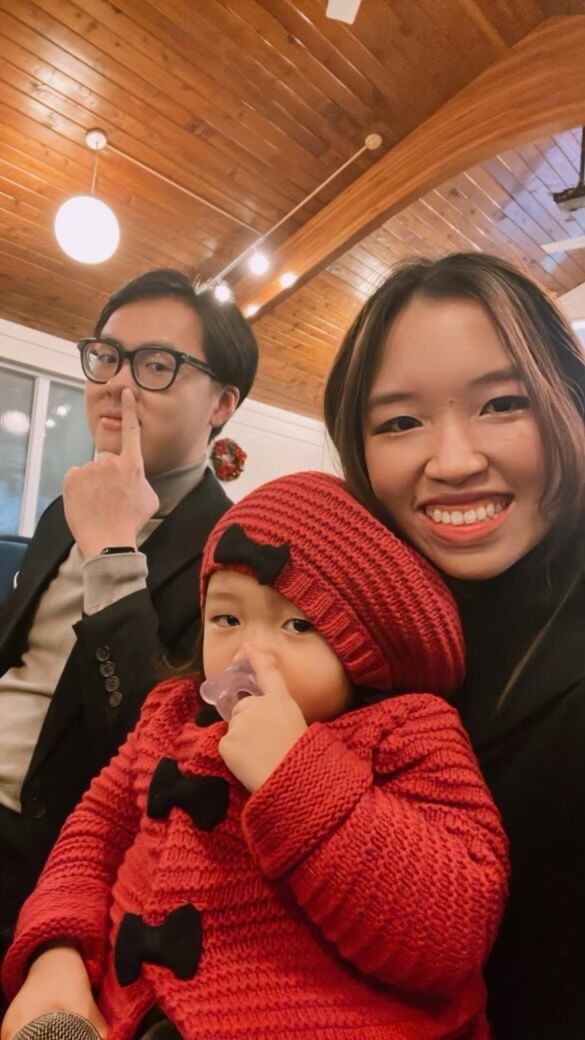 Attending Christmas Eve service with her family.