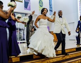 Couple holding hands after exchanging wedding vows