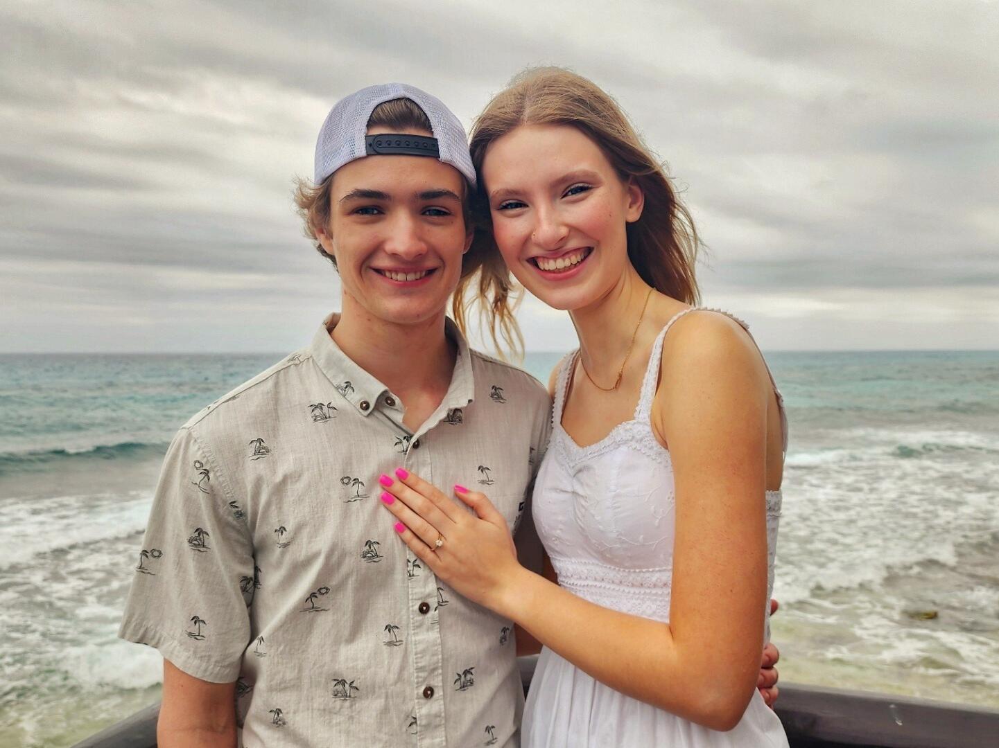 In April 2024, Owen and Ella ventured on their first vacation together to the beautiful Isla Mujeres, Mexico. On the morning of April 4th, with the sun peeking over the horizon, Owen invited Ella for a sunrise walk along the beach to which she obliged. As they wandered overlooking the sea, Owen suddenly paused beside a grove of vibrant tropical plants. Ella turned to see what had captured his attention, only to find him kneeling before her. With the waves gently lapping at the shore, Owen asked Ella to marry him, and SHE SAID YES! 