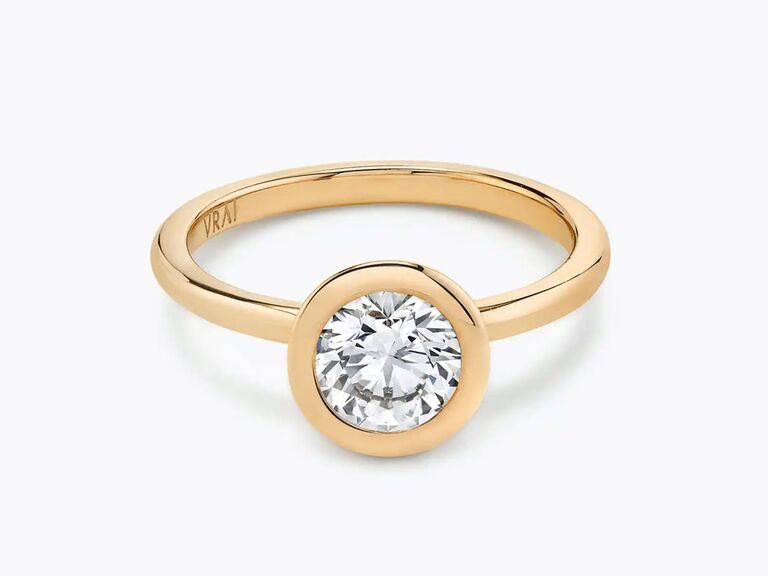 vrai round cut engagement ring with round diamond center stone and plain yellow gold band