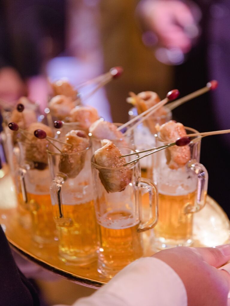 Pigs in a blanket with tiny beer steins for your wedding reception