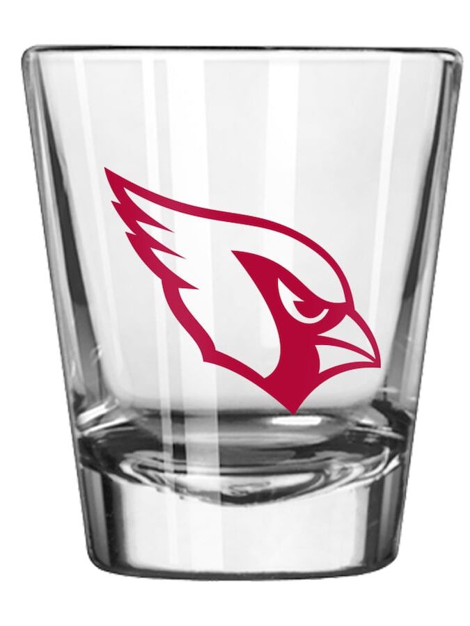 A clear shot glass with the Arizona Cardinals logo
