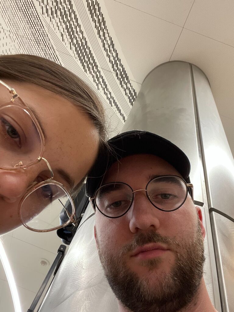 Photo taken while Daniel and Chloe have a 5 hour flight delay on their way to celebrate their friends, the Poynor's wedding. They eventually land in Texas at 3 am. Gig 'em.