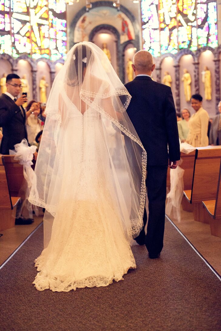 Natalie wore a handmade cathedral veil from Vietnam at her Catholic ceremony, which took place at Queen of Apostles Church in Alexandria, Virginia.