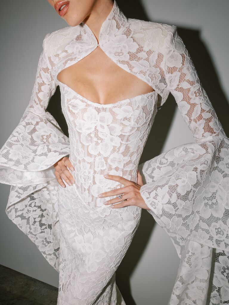 Long sleeve lace wedding dress with fitted sheer bodice, high collar neckline and key-hole opening