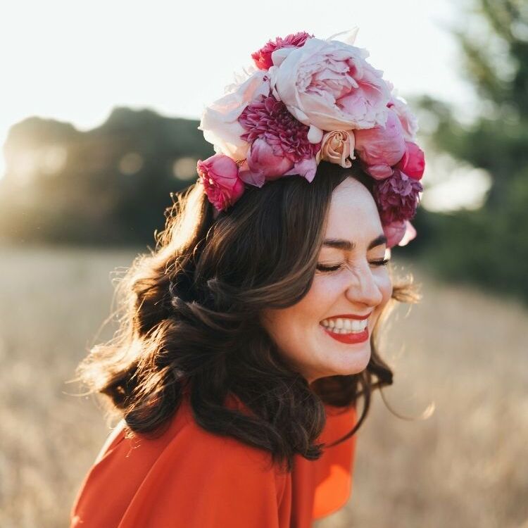 bride in red dress with pink peony flower crown