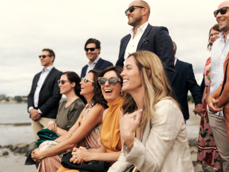 Guest sitting together and laughing during ceremony