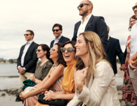 Guest sitting together and laughing during ceremony