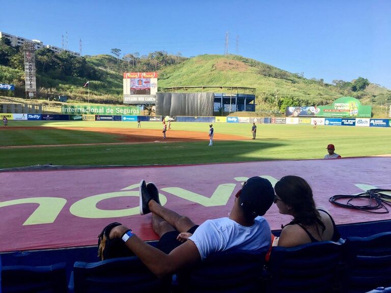 Diego taking Ana Laura to her first baseball game in the Rod Carew