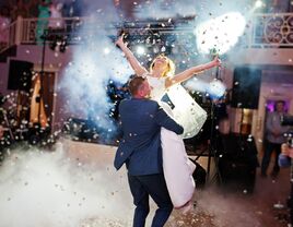 Groom lifting his bride during a spectacular first dance