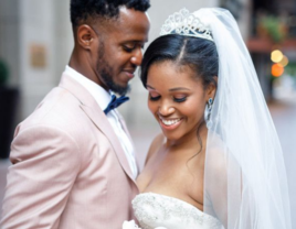 Couple hugging and holding white wedding bouquet