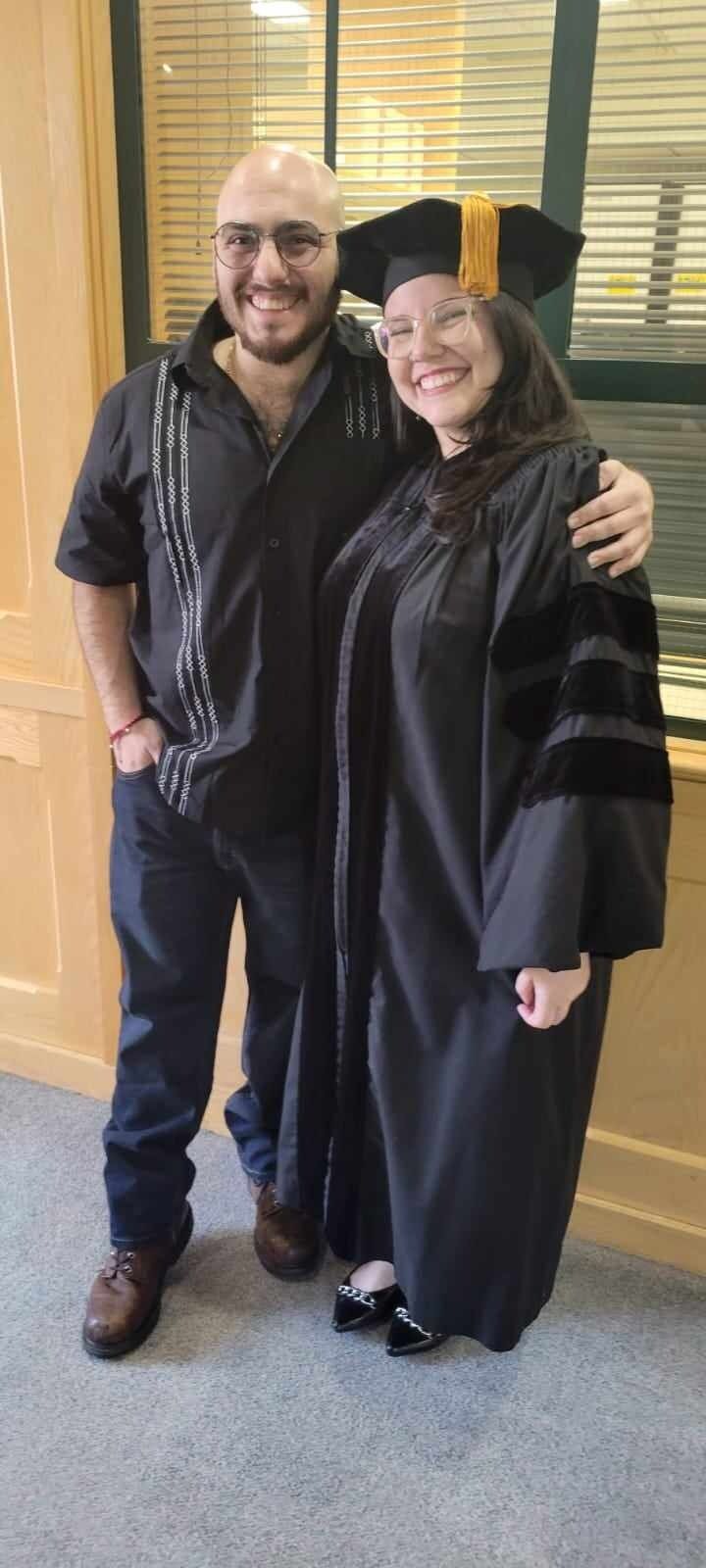 Jeny receives her PhD degree and Matt is there to celebrate