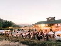 Outdoor barn wedding reception with string lights