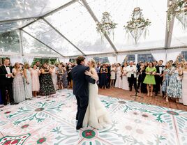 Couple dancing surrounded by guests at country club wedding