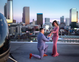 Man proposing to woman on rooftop Ventanas in Atlanta