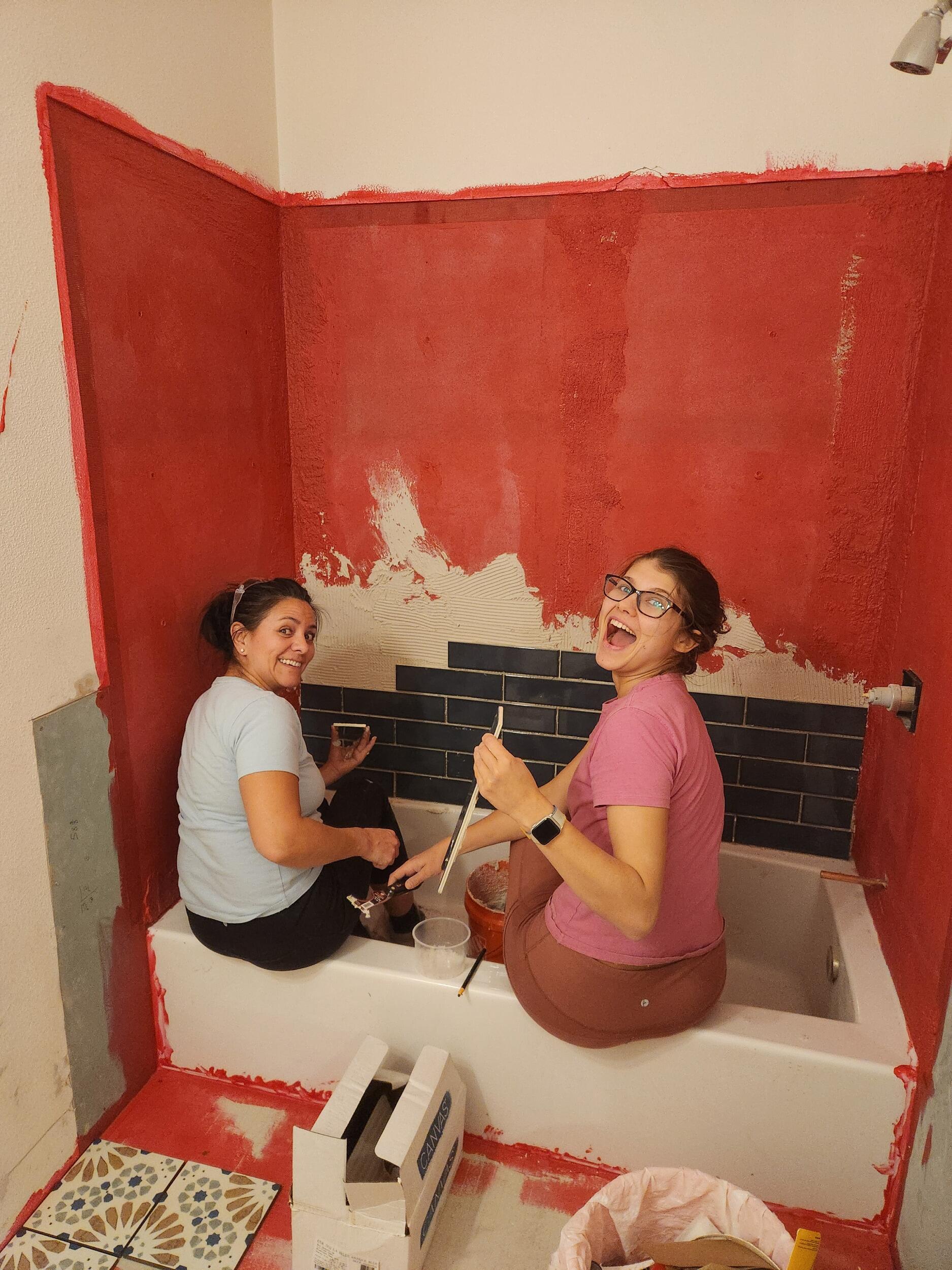 A burst pipe in the house spurs a six-months long renovation, led by Project Manager Devon. Everyone chips in when they visit, including Dima, Oksana, and Nichol, the tile expert!