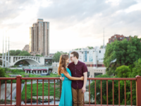 Couple hugging on bridge in Minnesota