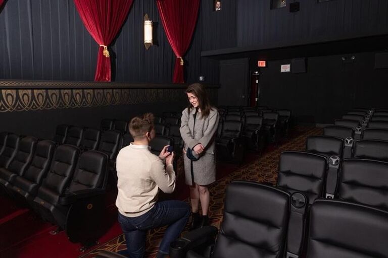 Nick proposes at The Logan Theater, one block up Milwaukee Ave from where we first met. Katie says "YES!"