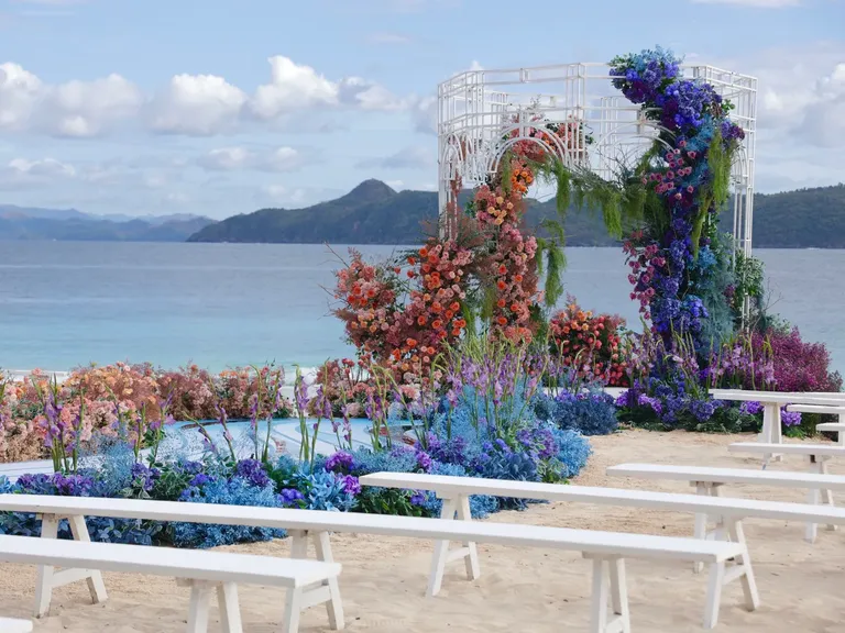 gorgeous flowers leading up to ceremony stage