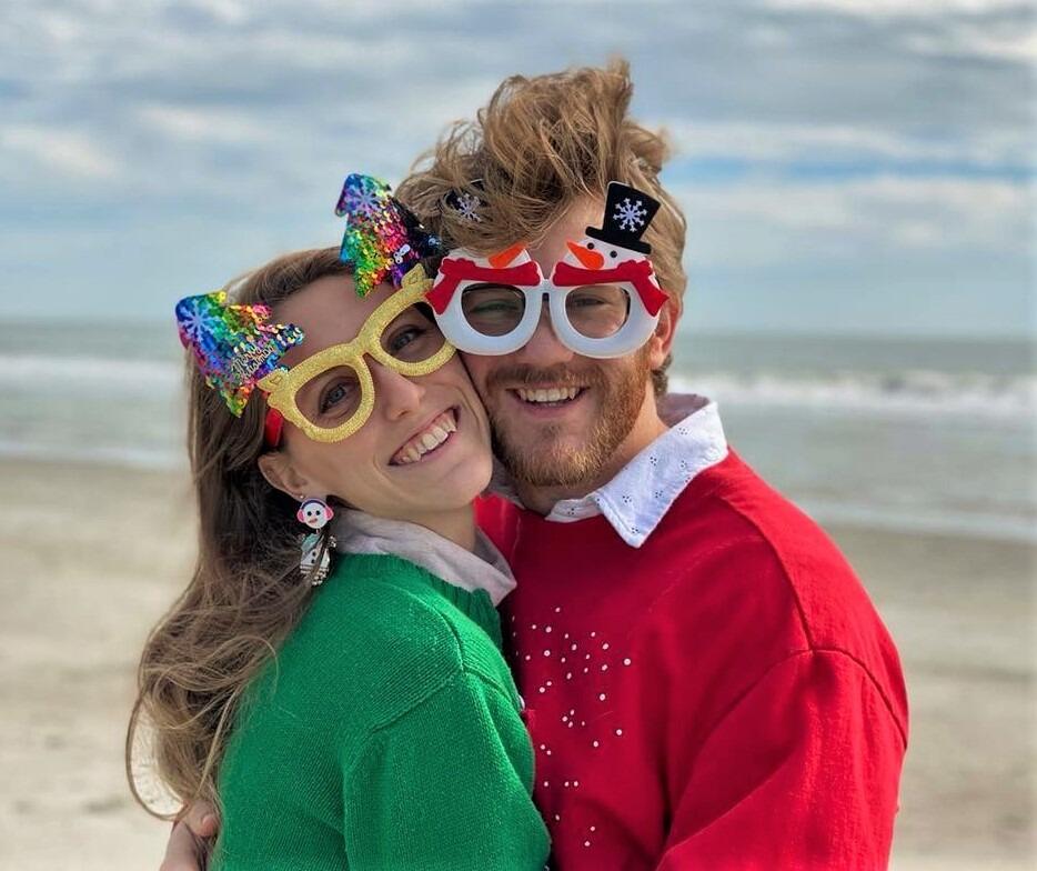Kara and Alex loving being able to walk along the beach over their first Charleston Christmas!