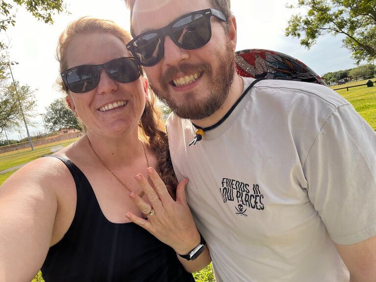 Amanda: Tyler asked me to marry him during the solar eclipse. We shared pub subs and Publix cookies, and he gave me (back) my grandmother's ring.

My grandfather found the 1 carat diamond under a park bench more than 50 years ago, and had it set into a thin gold band for my grandmother, who passed away in 2007. I was gifted the ring on my 18th birthday, and always dreamed of being proposed to with it.

We chose another, personal ring together, with the 5 diamonds on it representing each of the years we spent together before promising each other forever.