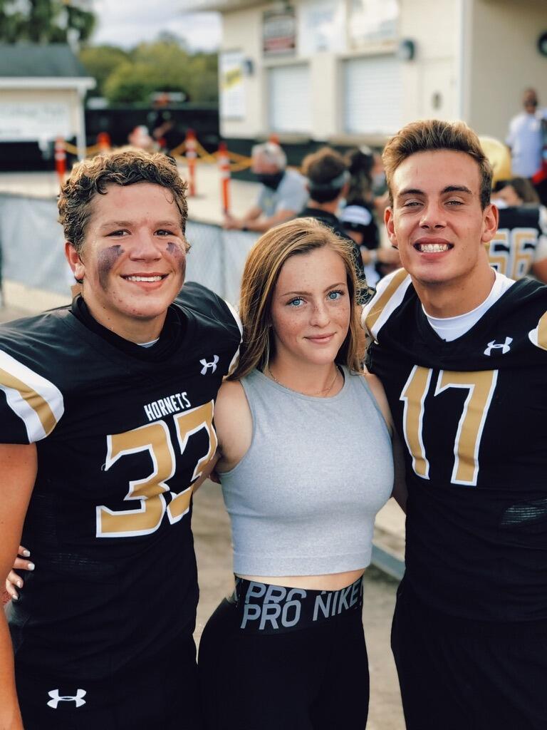 Brett, Emma, and Dillon at the boys football game at Bishop Moore!