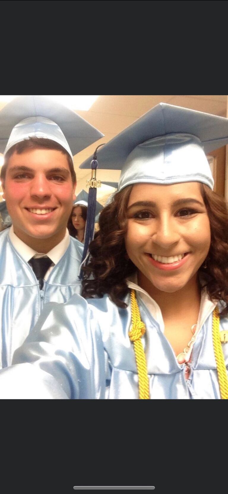 Thinking they took there first photo in 2019, Kelly and Michael  have always been connected, just missing each other until the time was right. This photo bomb was taken at their high school graduation. Kelly and Michael's name were just three people apart and they were in the same math class senior year! ( do you see kelly?)