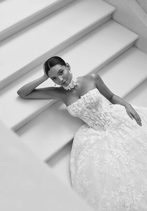 Princess silhouette wedding dress with sweetheart neckline, removable off-shoulder straps, crafted in lace with corset back closure.