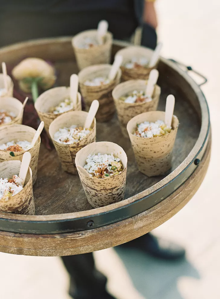 corn salad in bamboo cups on tray