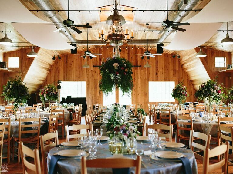 Indoor reception space with wooden walls and industrial ceiling