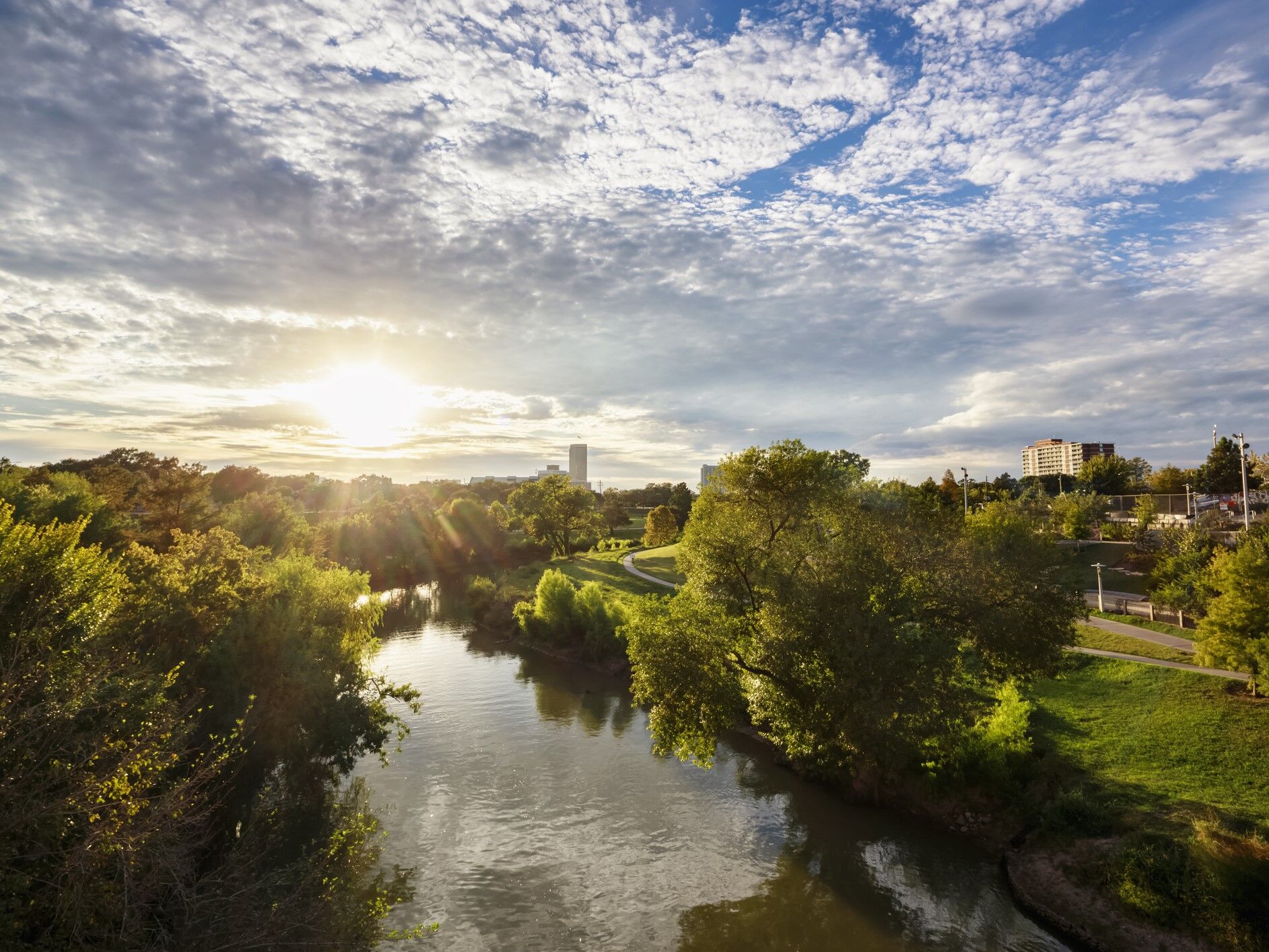 things to do in Houston for couples - the sun rises over a gorgeous river landscape