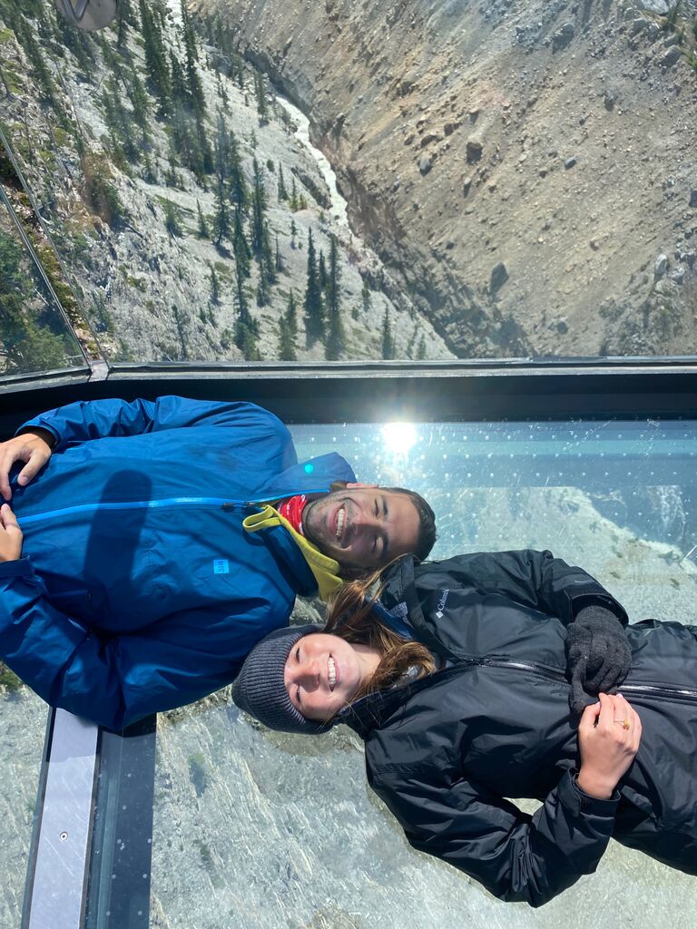 Enjoying the world while lying down on the Columbia Icefield Skywalk 