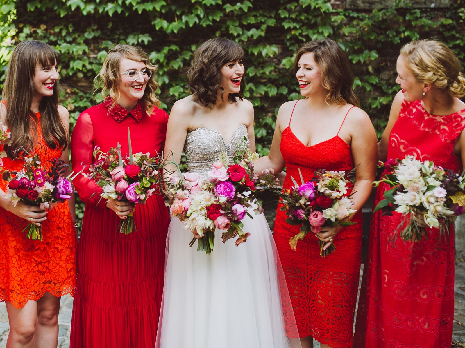 Mismatched Bridesmaid Dresses in Red, Orange and Pink