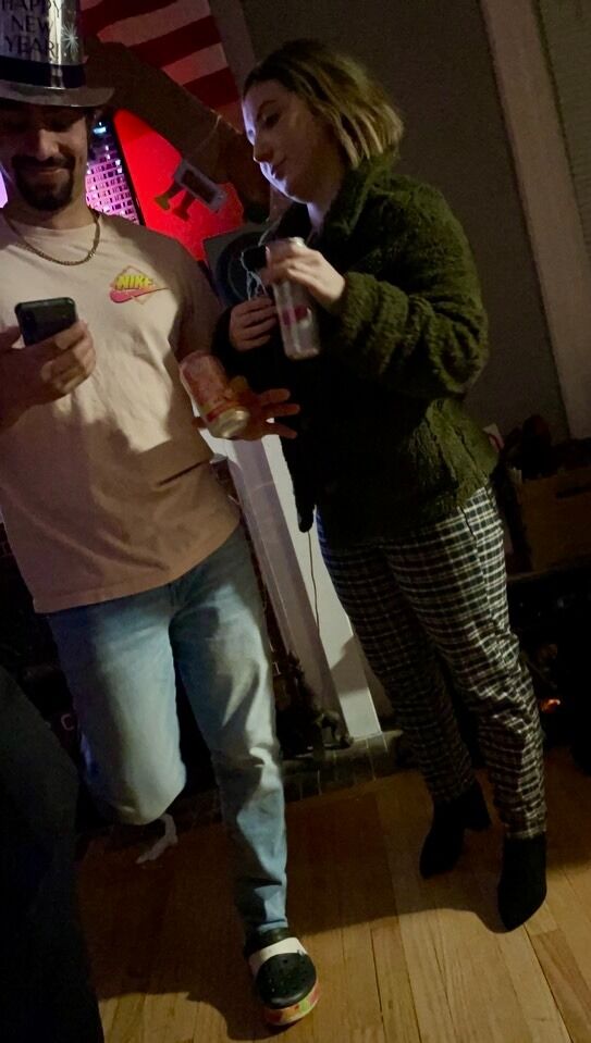 Nick invited Meaghan and her sister, Katie, over for a New Year's Eve party. Katie snapped this picture shortly before their first kiss!