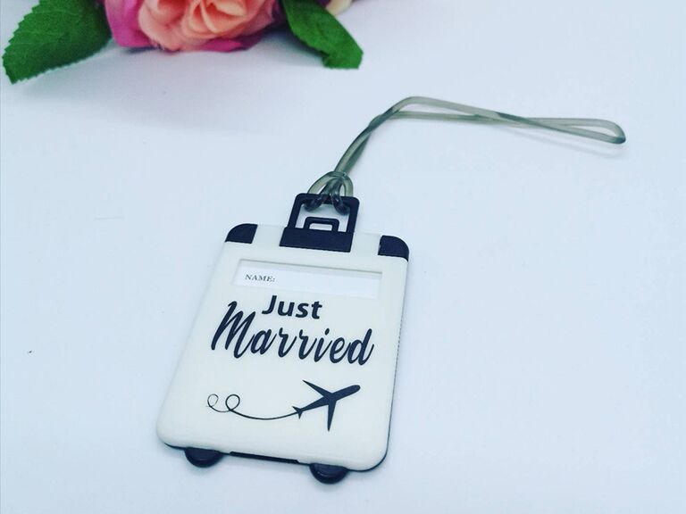 Suitcase design with 'Just married' and airplane graphic in black and white