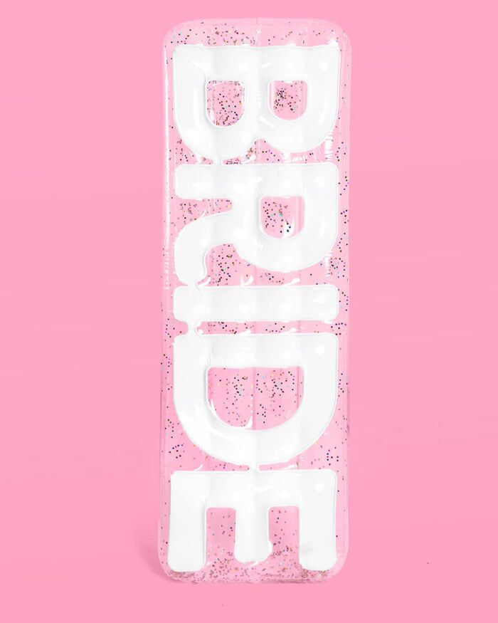 Bride pool float with glitter confetti