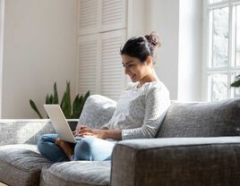 Women using laptop at home