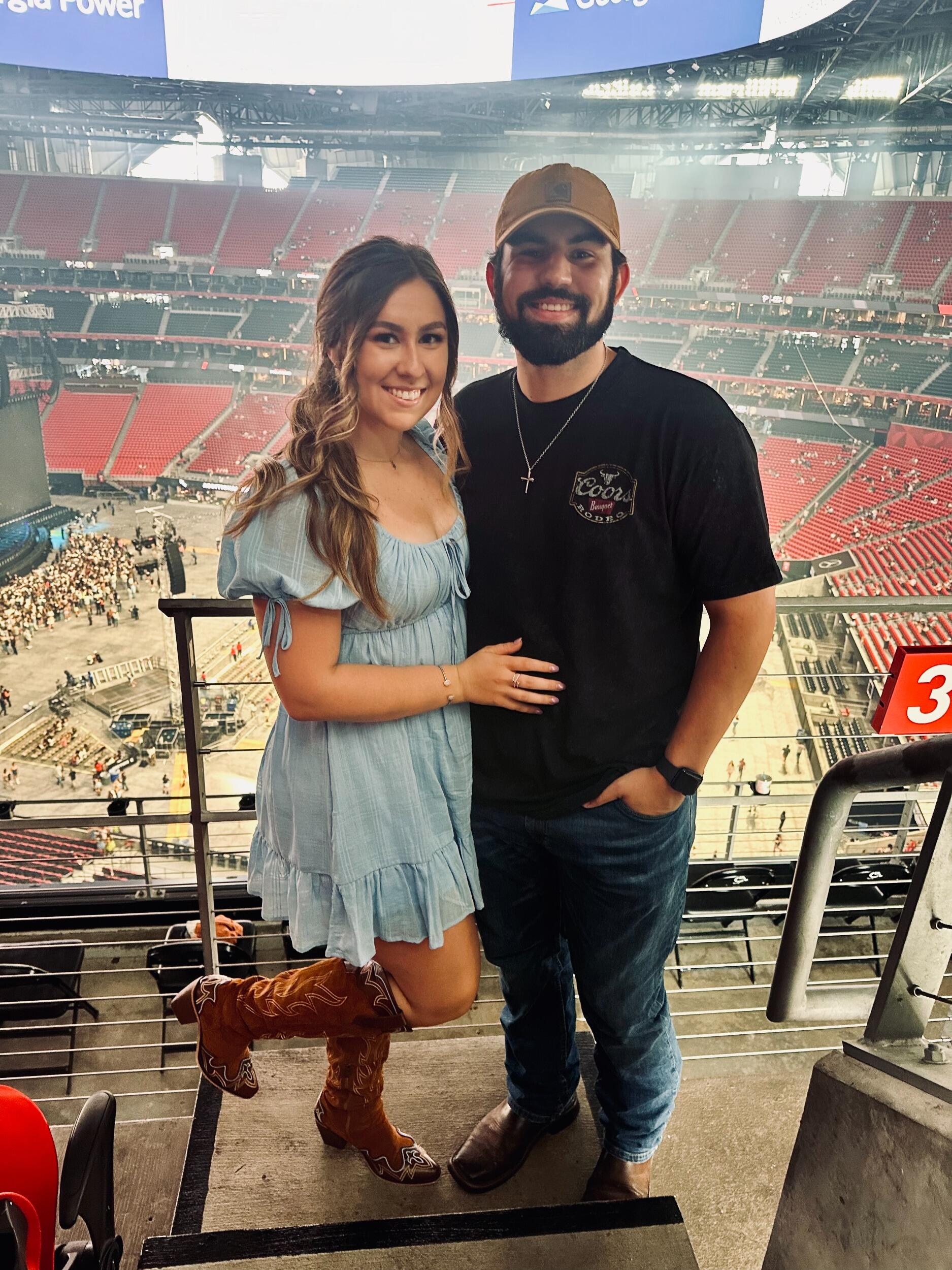A picture we took at a Zach Bryan concert in Atlanta, and Sara wore her first pair of "cowgirl boots"!