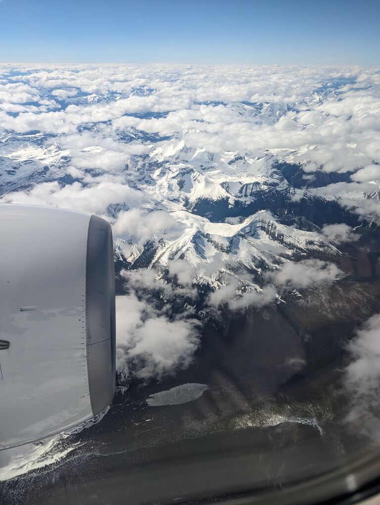 Chris made certain Ashley had a window seat, that way she would get the best view of the Rockies as they flew into Alberta! 