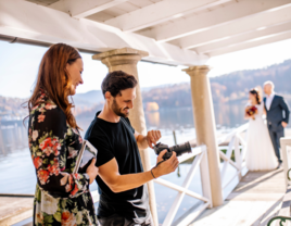 Two photographers looking over wedding day photos