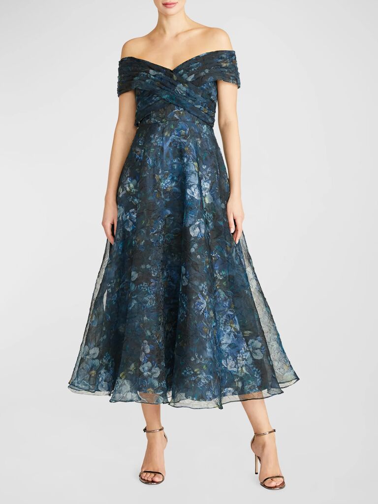 A blue floral over-the-shoulder midi dress with a criss-cross bodice from Neiman Marcus