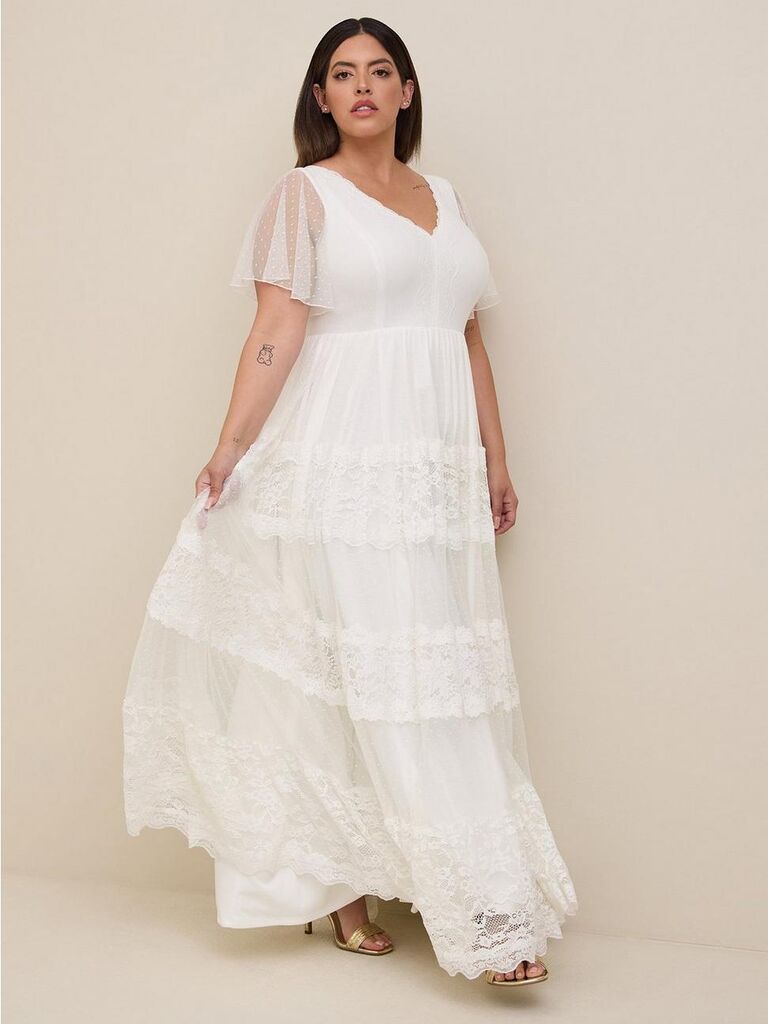 White fluttering plus size wedding dress by Torrid. 