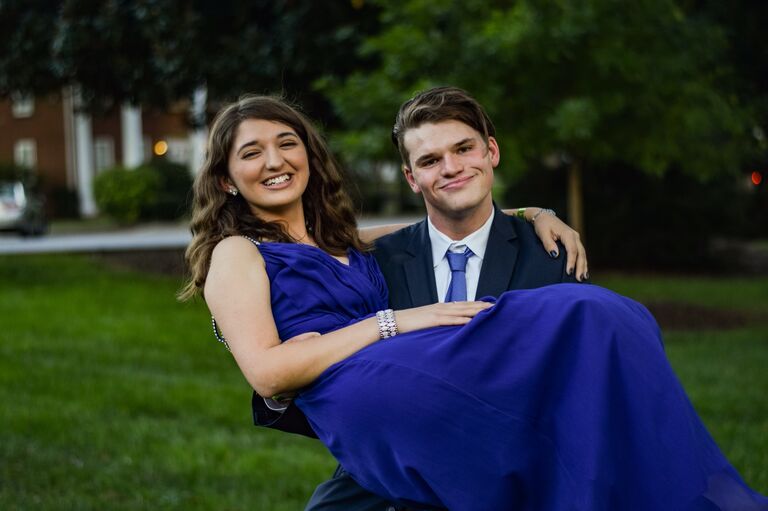 Madi and Josh's first school dance together. They pose before heading in.
