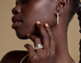 Woman wearing round lab grown diamond ring from Grown Brilliance, diamond alternatives