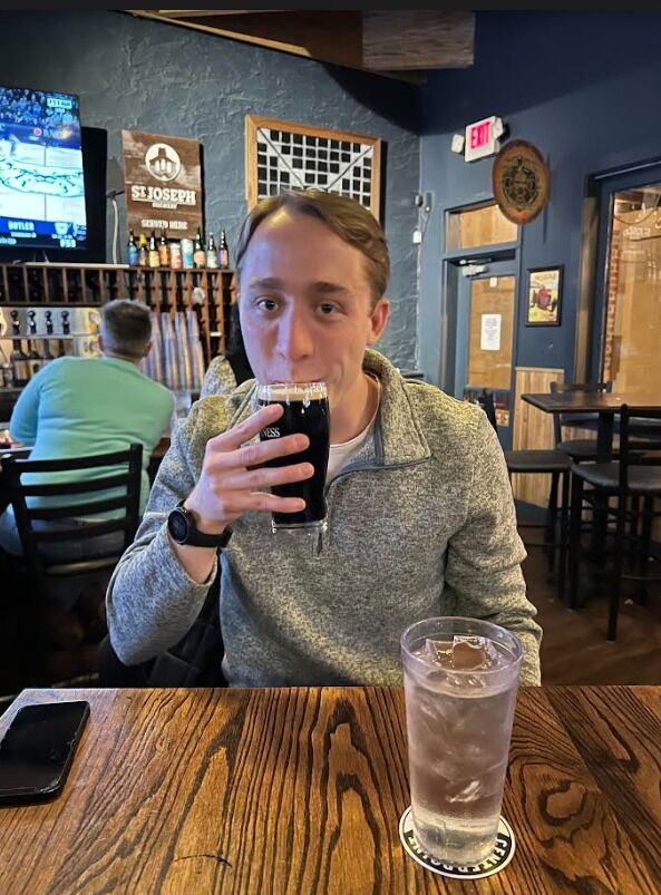 The first of endless moments Claryce would force Daniel to take a picture with his food or drink.